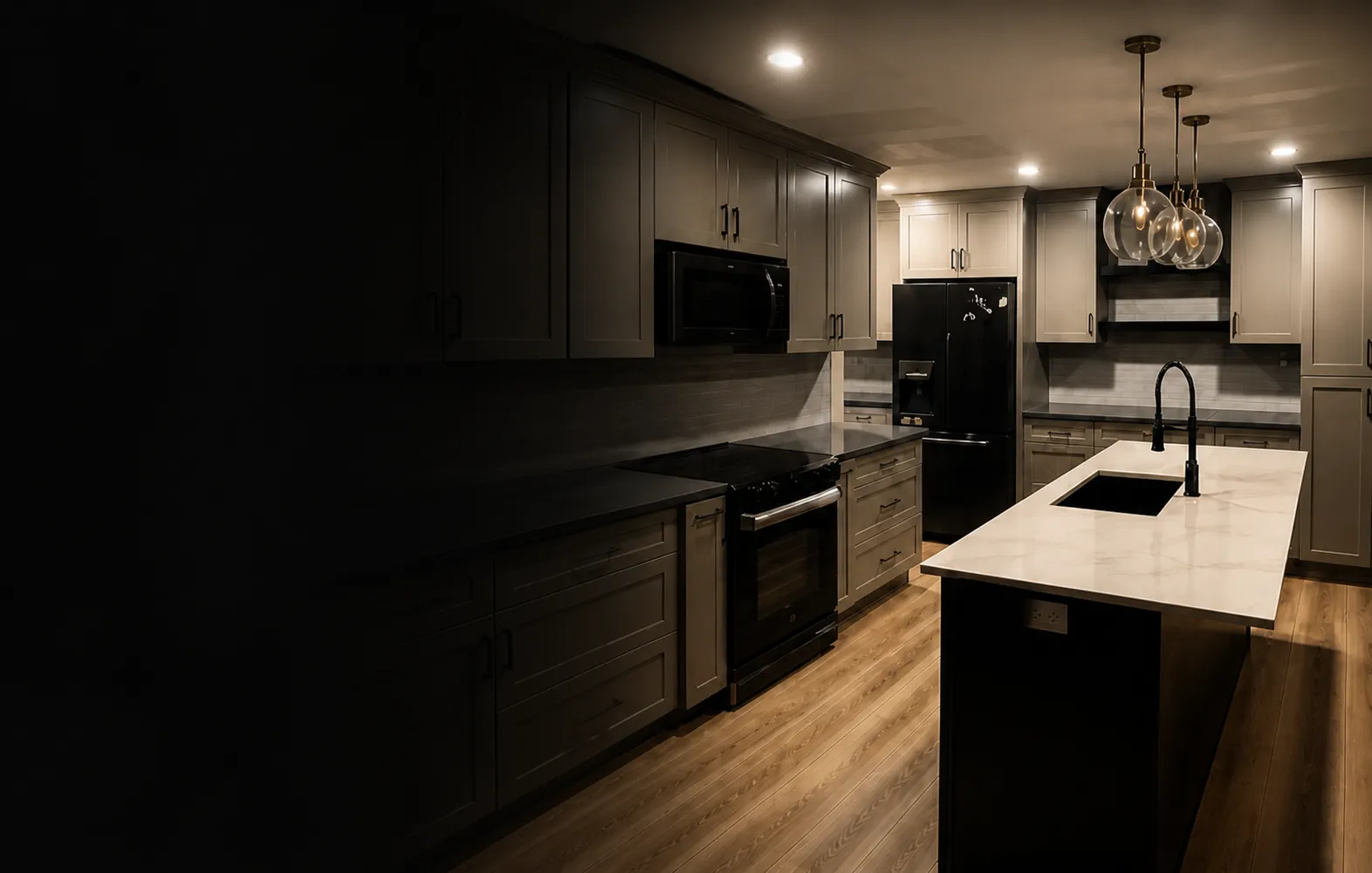 Finished kitchen with shaker cabinets and a waterfall island
